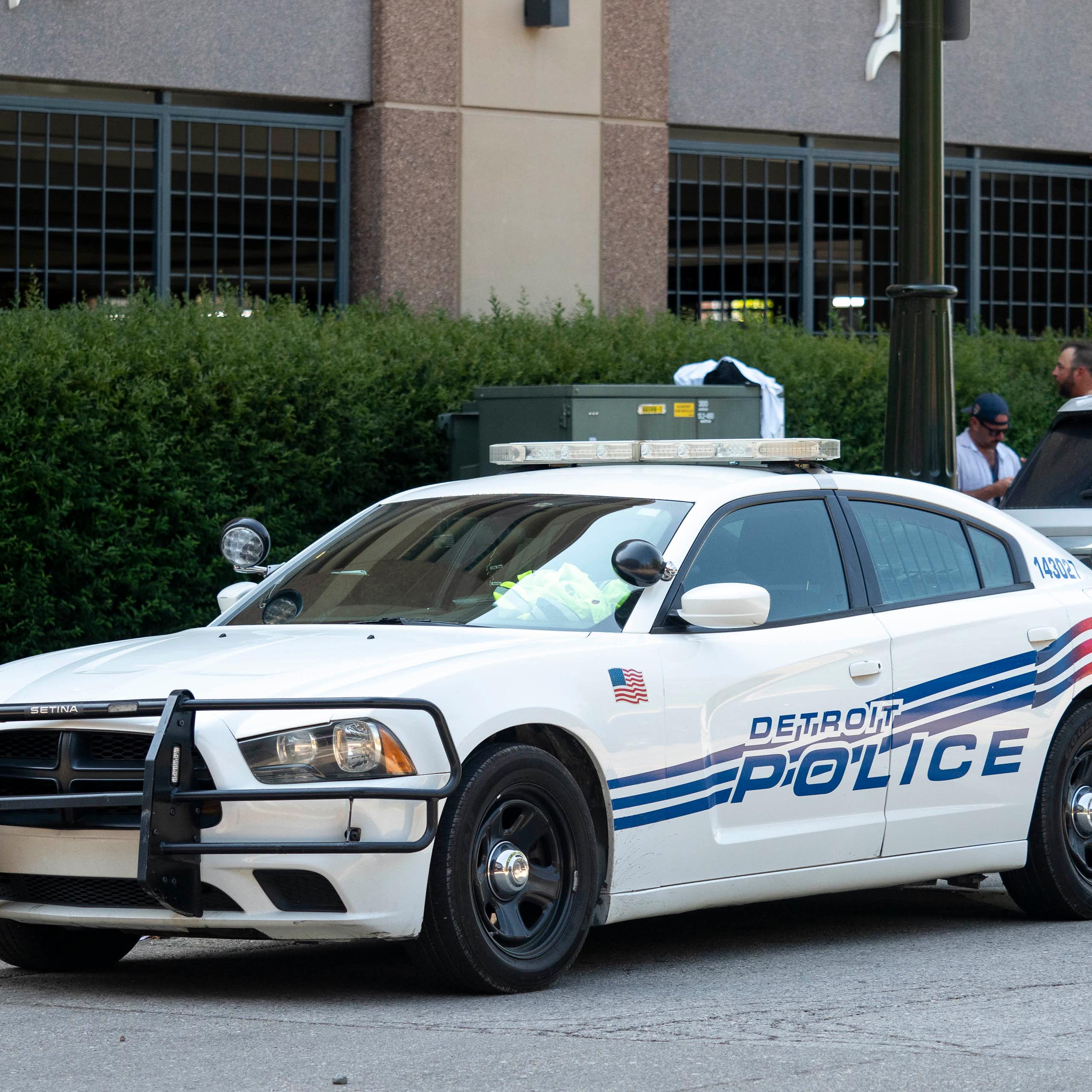 Detroit police car parked near sports venue
