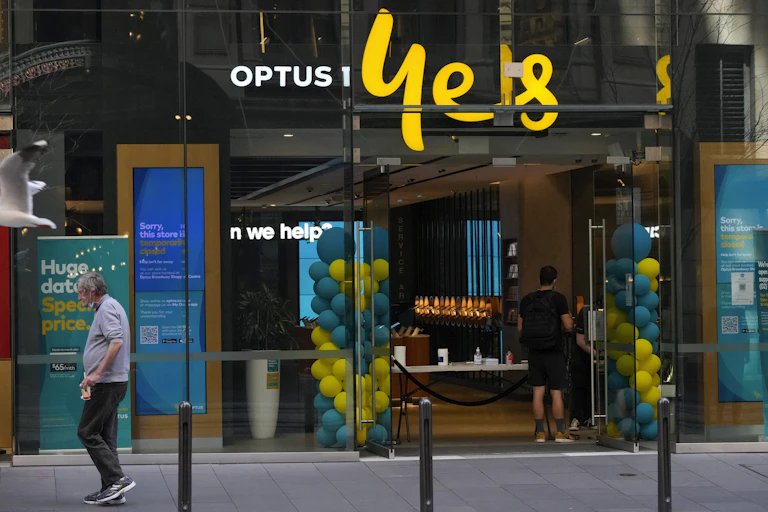 An Optus shopfront in a city.