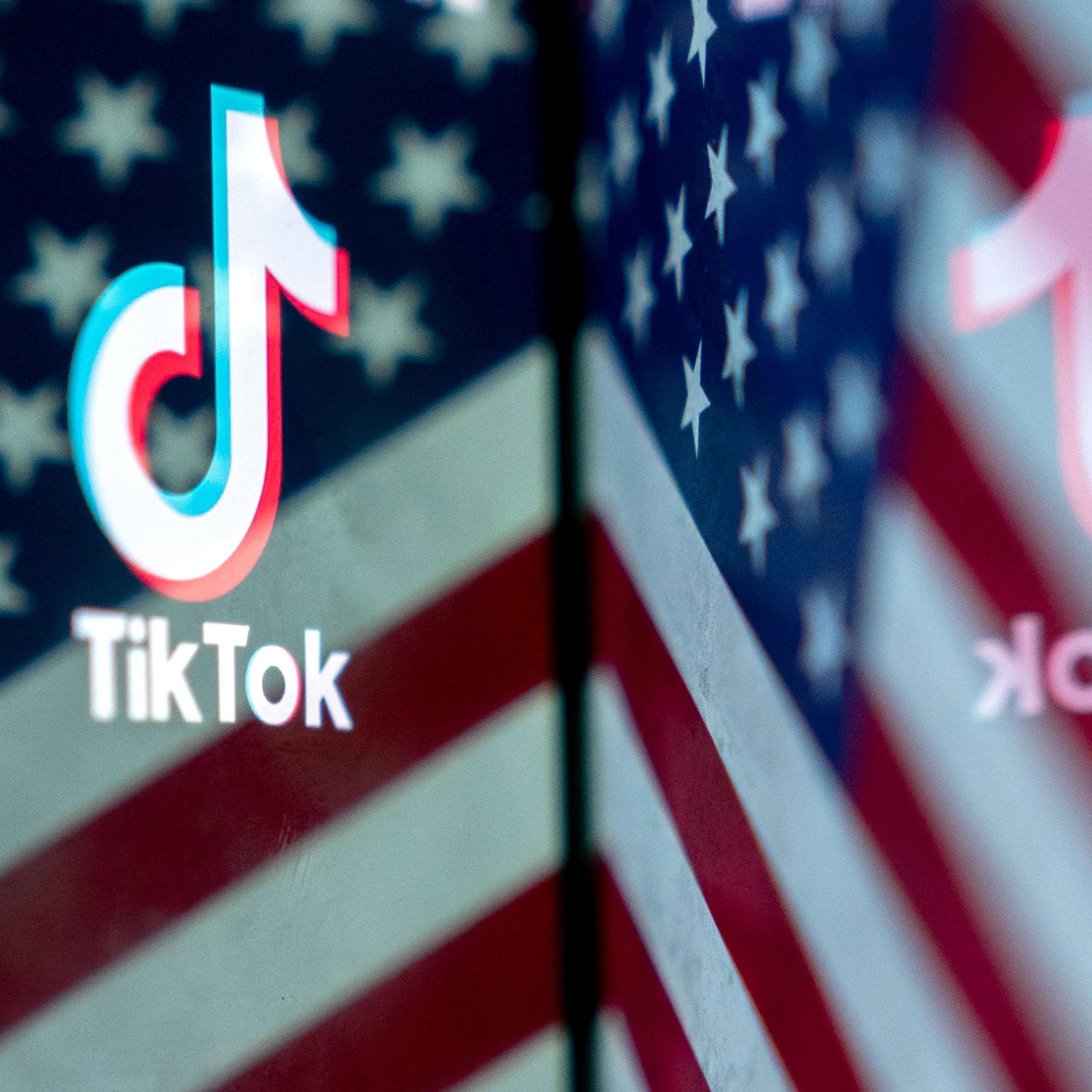 a logo and small amount of text superimposed over a section of a red, white and blue flag