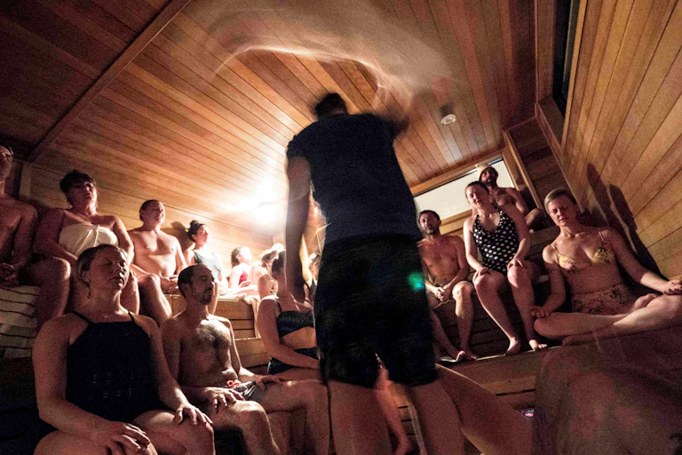 An aufguss event with the saunameister wafting his towel about.