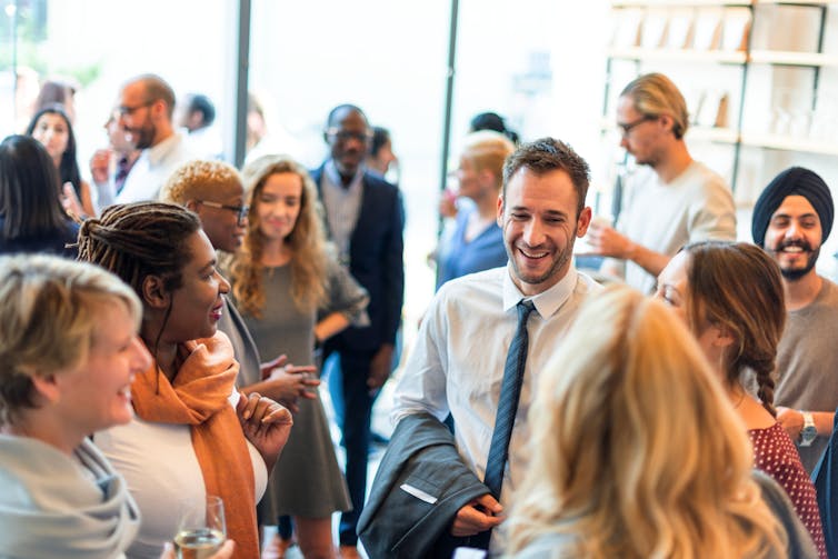 a group of people chatting and networking