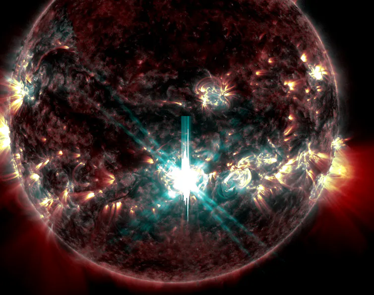 an image of the Sun showing a bright spot representing a solar flare