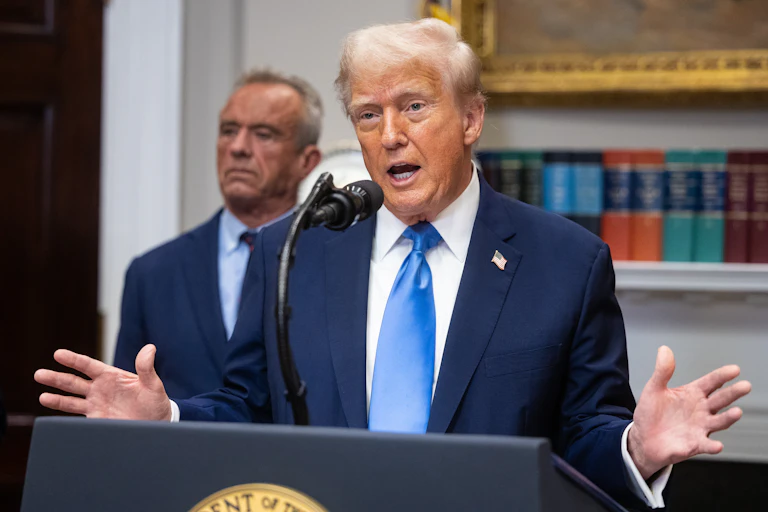 US President Donald Trump at lectern, at autism announcement