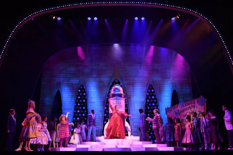 Cast of the 20th anniversary show of Hairspray are seen on stage at the Sydney Lyric Theatre.