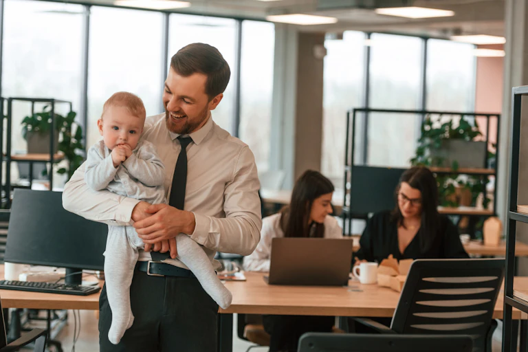 Father with baby in office