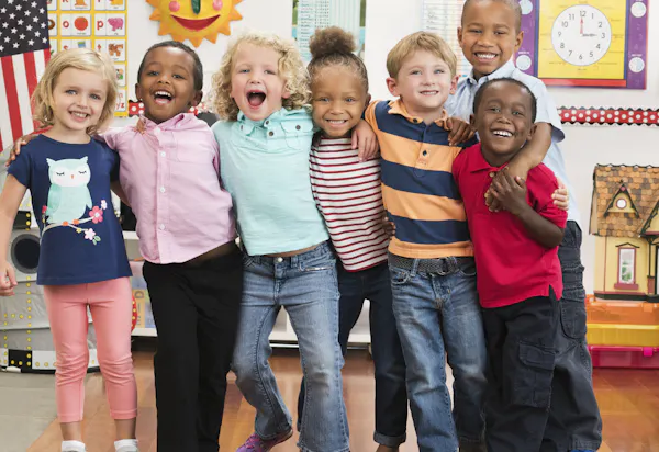 A group of kindergarten-age kids in a classroom