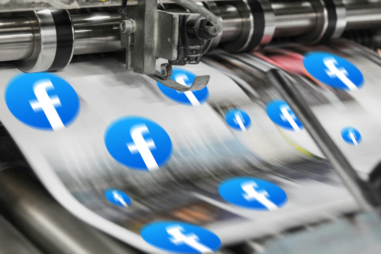 A newspaper printing machine with facebook logos on the paper