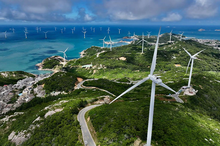 Wind turbines on land and sea.
