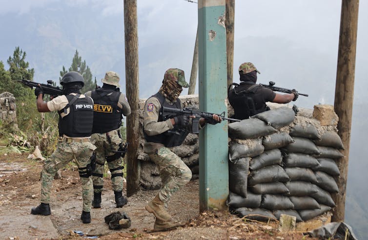 Haiti is enlisting the assistance of mercenaries in its combat in opposition to gang violence 1 Haitian policemen fire their weapons after an attack by an armed gang.