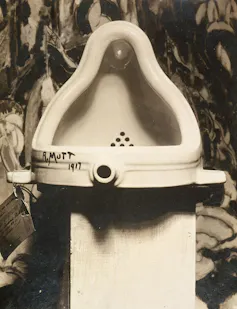 A urinal signed 'R.Mutt'.