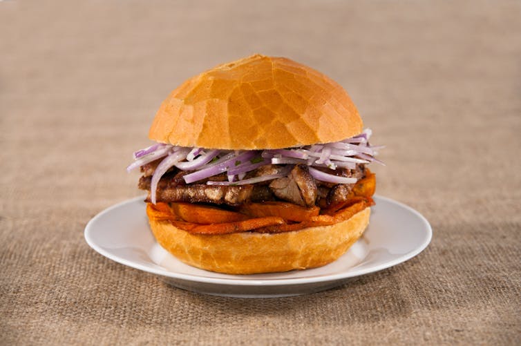 Peru's pan con chicharron -- a pork and sweet potato sandwich..