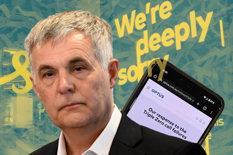 Optus CEO Stephen Rue in front of Optus signage and a phone