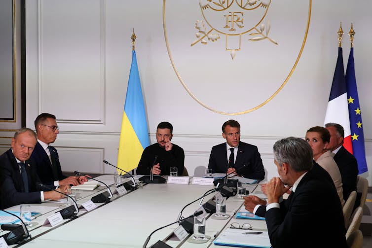Leaders of the 'coalition of the willing' sit around a long table with Volodymyr Zelensky in Paris, September 2025.