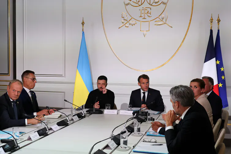 Leaders of the 'coalition of the willing' sit around a long table with Volodymyr Zelensky in Paris, September 2025.