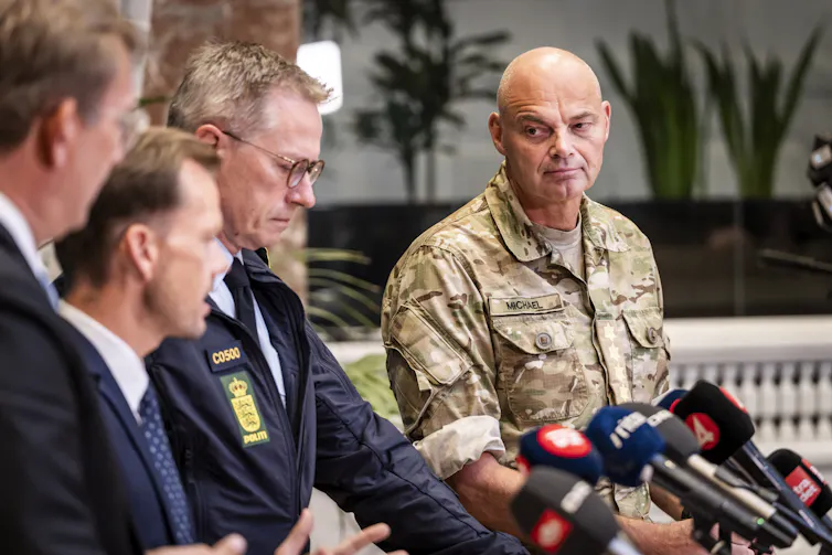 Danish ministers speak at a press conference.