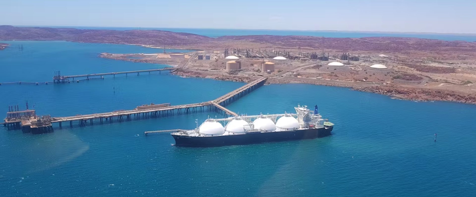 A gas ship moored at a wharf off the Pilbara coast.