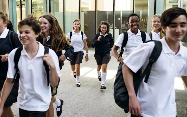 Children outside school in uniform
