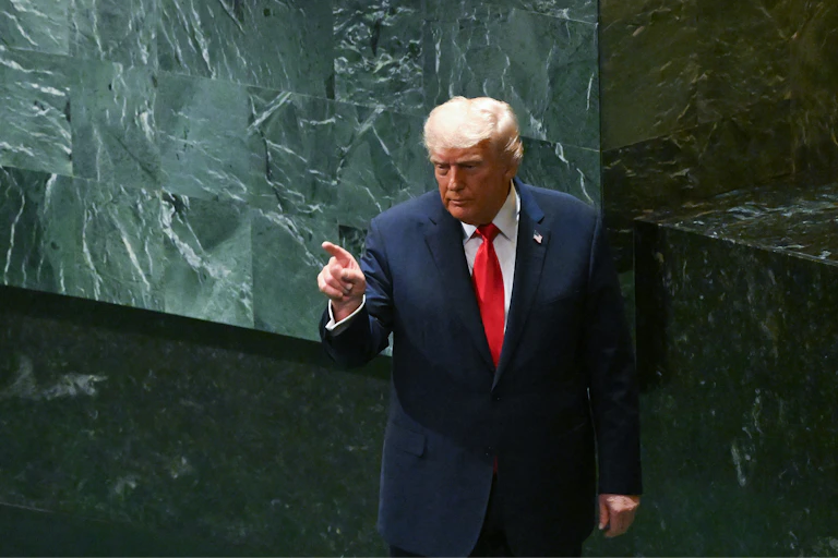 Donald Trump points to his audience after speaking at the United Nations, September 23