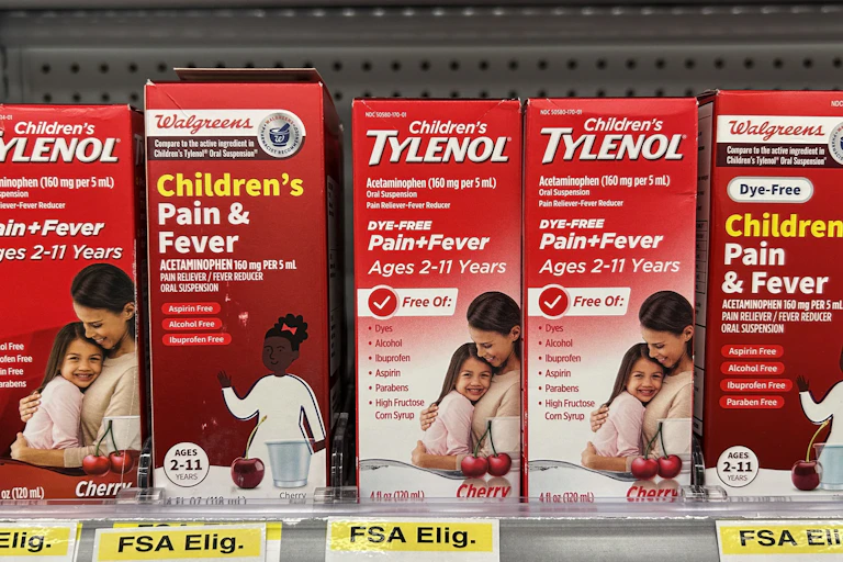 Boxes of acetominophen-based medications on a store-shelf.