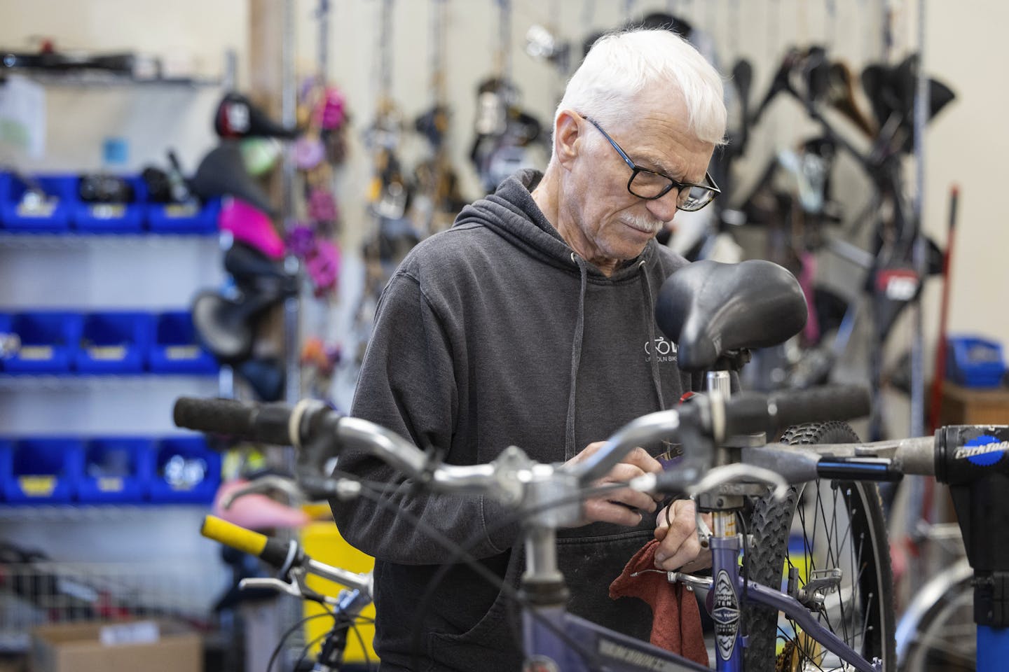 A man fixes a bicycle.