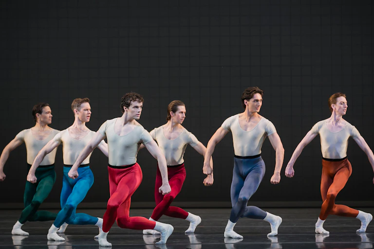 A line of male dancers.