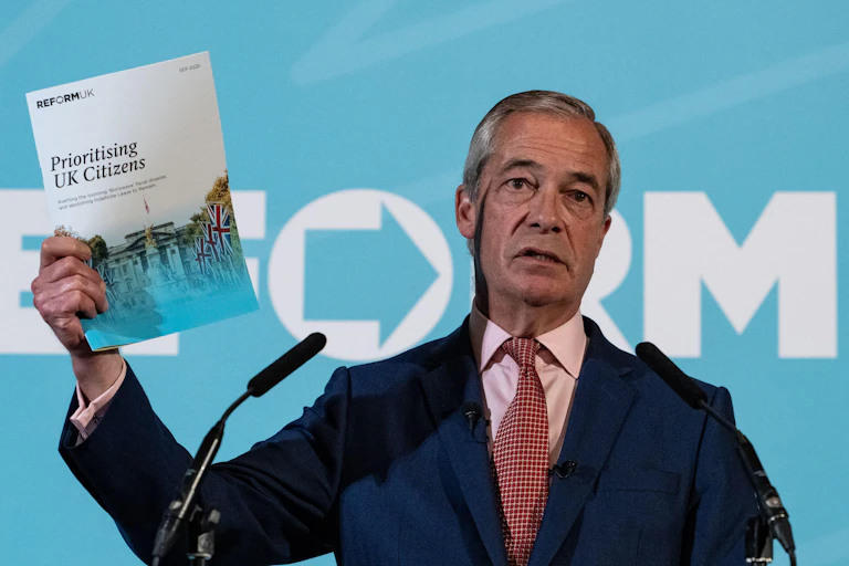 Nigel Farage holding up a document titled 'Prioritising UK Citizens'.
