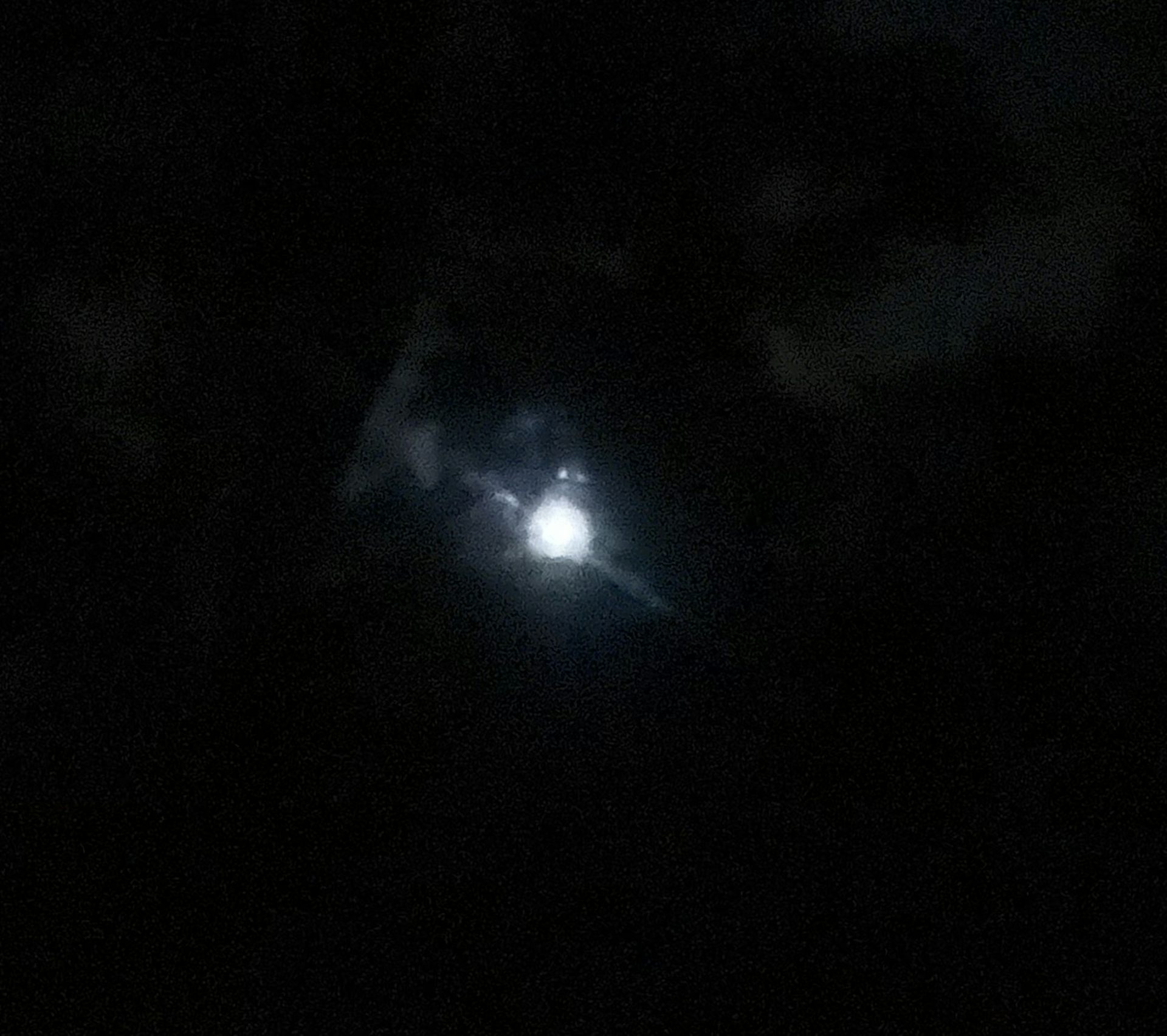 An image of the Moon that's just a fuzzy white blob.