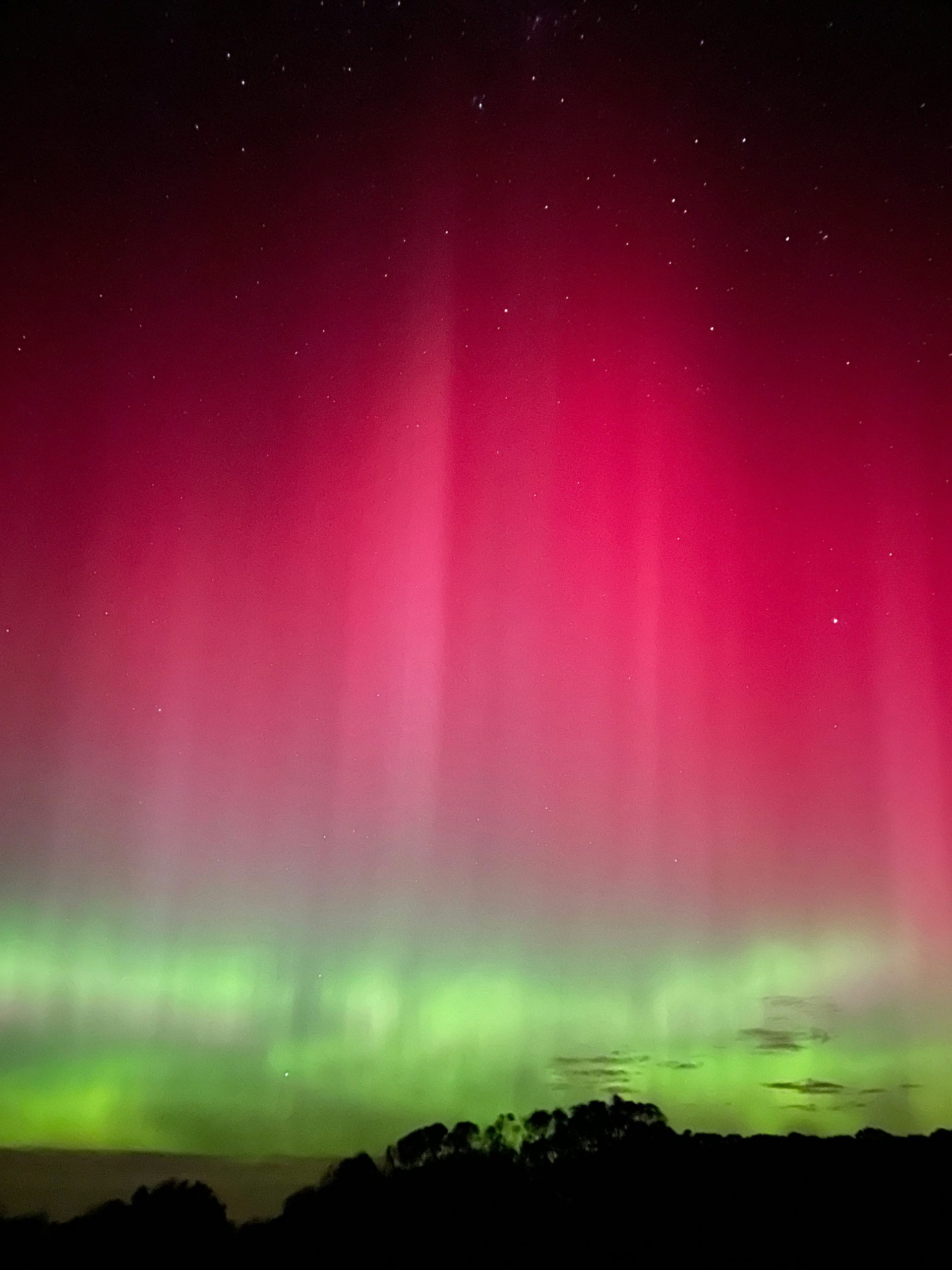 A phone photo of an aurora during the great display of May 2024.