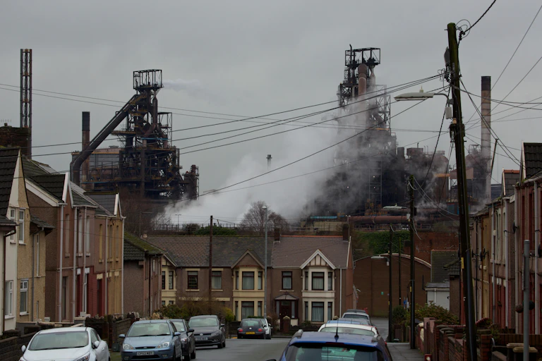 Houses with industrial buildings in background