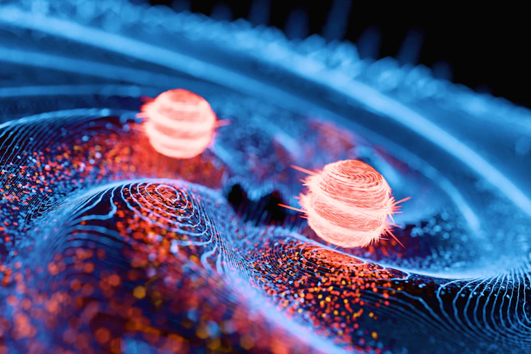 A drawing of two particles next to each other, on a wavy surface.