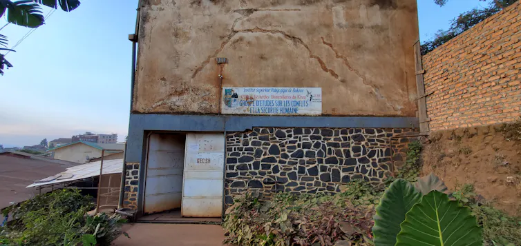 A brick building with writing above the entrance.