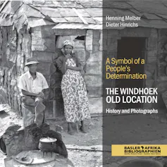 A book cover with a black and white photo of a man and woman against a shanty structure.