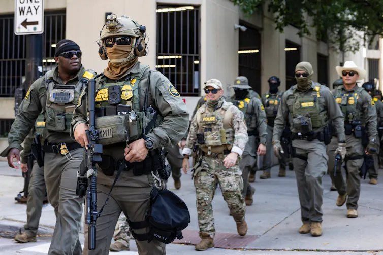 men in military uniforms walking