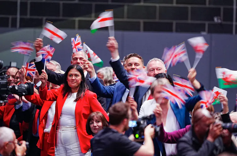 Government ministers waving flags.