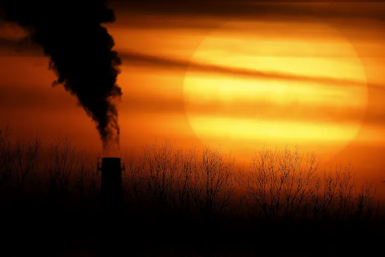 smoke billowing at sunset
