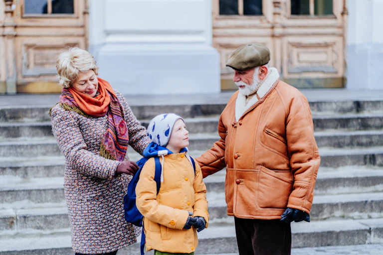 Grandparents taking child to school