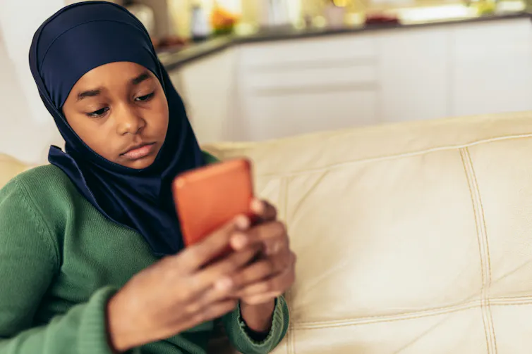 a young girl on her phone