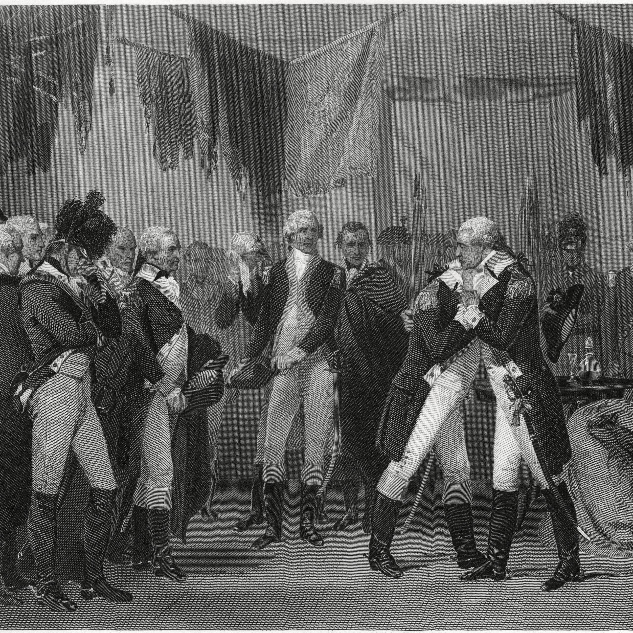 A man in a uniform embraces other men in uniform.