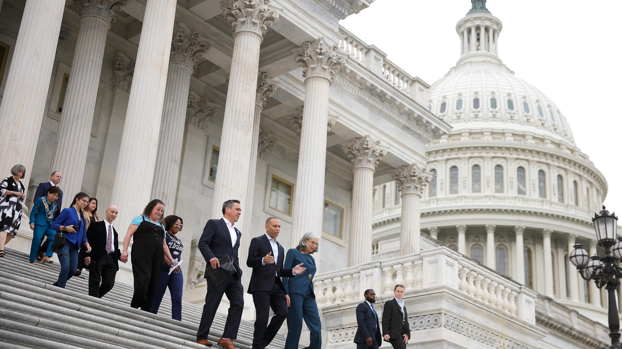 House Democrats walk down the steps of the U.S. Capitol Building