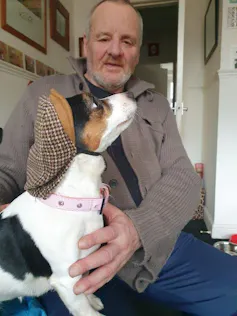 Max in his flat with Lily the dog.