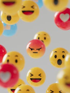 A background of different social media smileys.