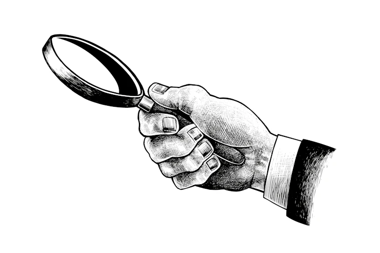 An illustration of a hand holding a magnifying glass.