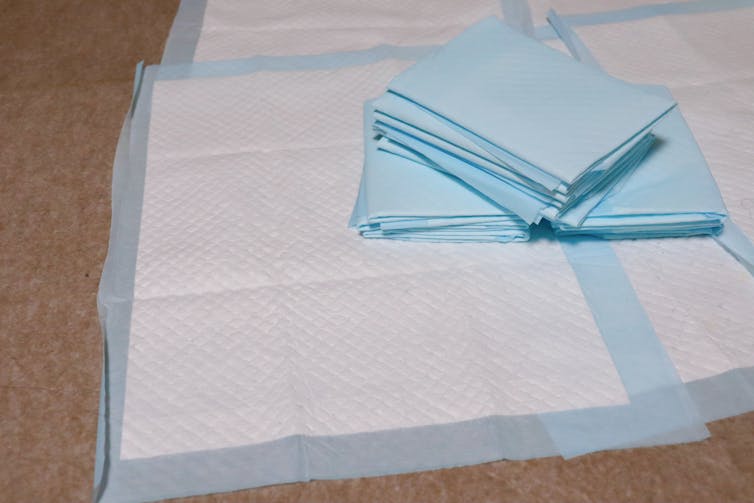 Disposable plastic-backed sheets.