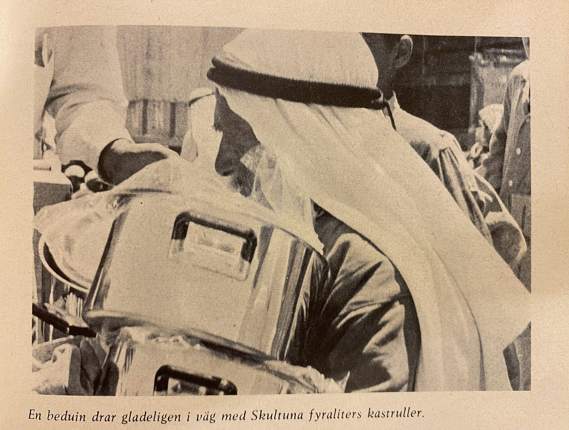 A Bedouin Arab man in Beit 'Awaa receives a Skultana cooking pot.
