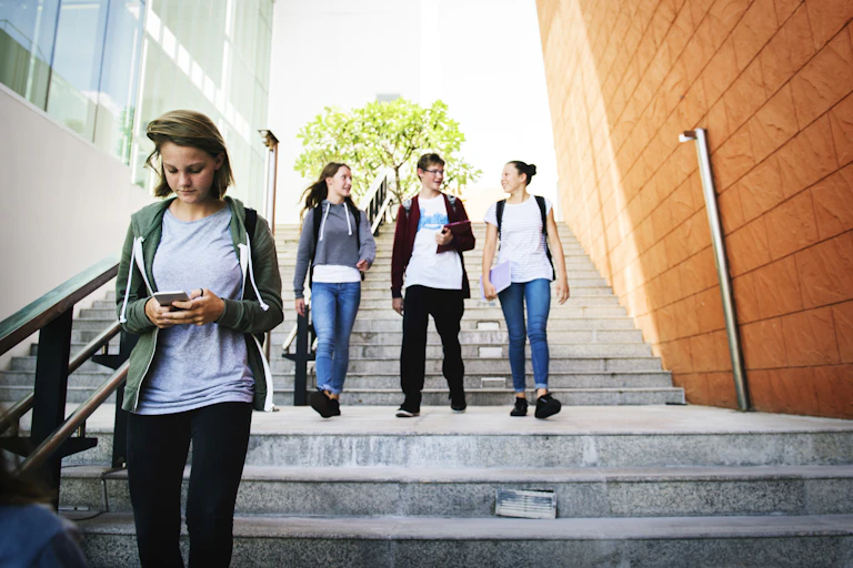 Students walking down steps