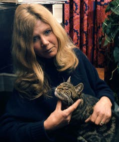 Jilly cooper holding a cat