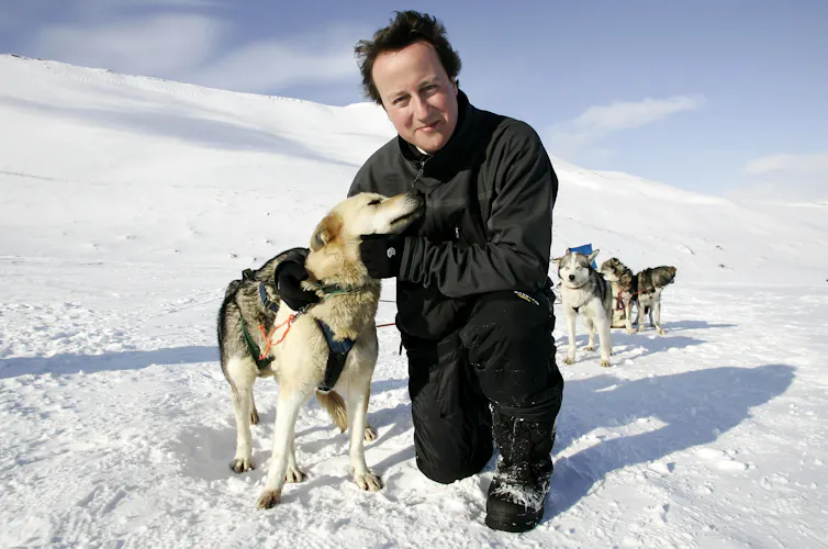 David Cameron on glacier with husky