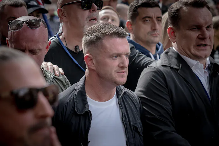 Tommy Robinson in a crowd of people.
