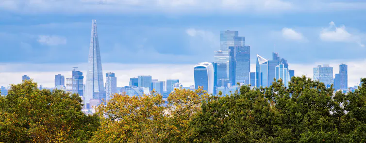 london city skyline with green trees