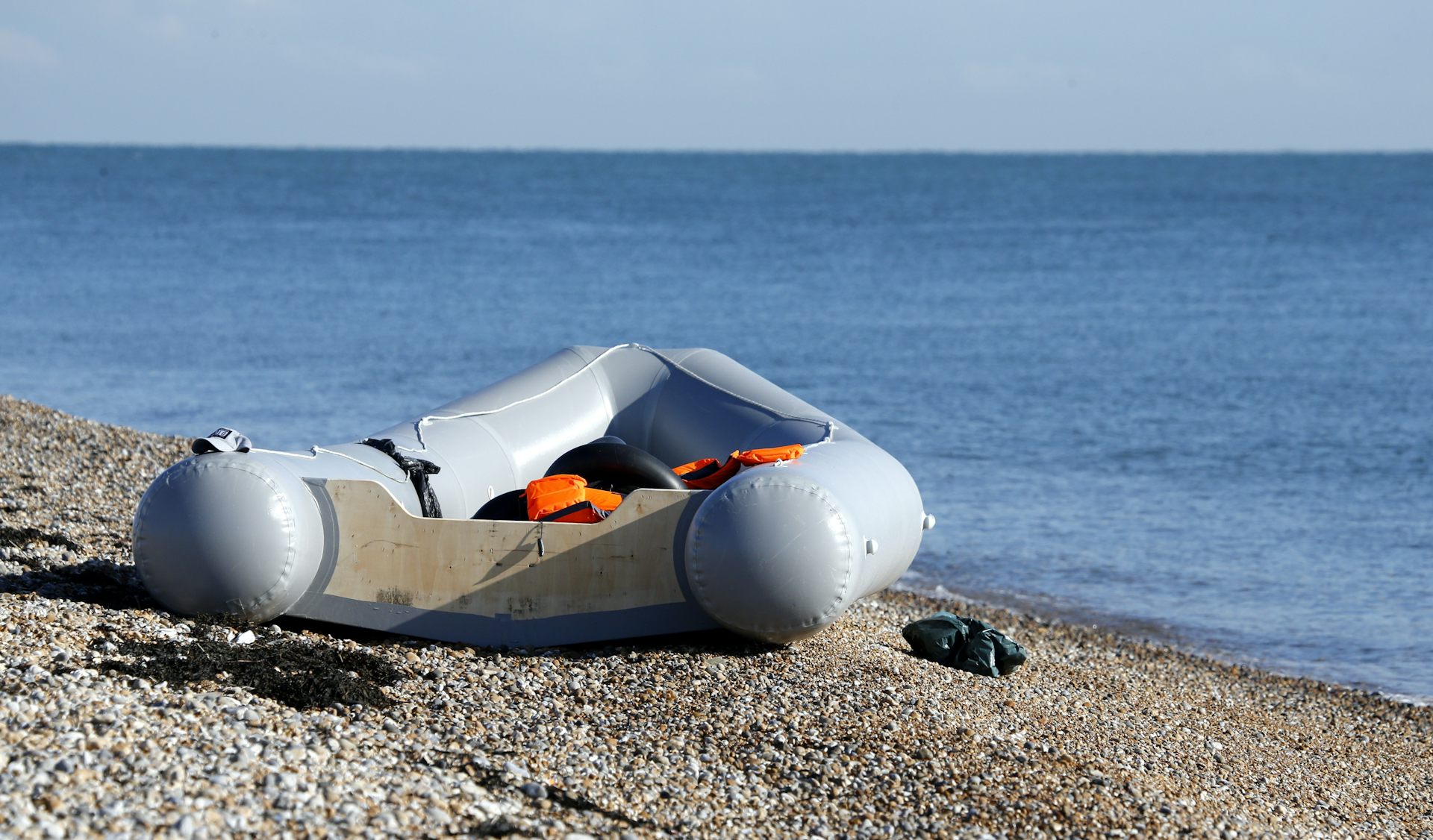 An empty dinghy sits on a beach in Kent